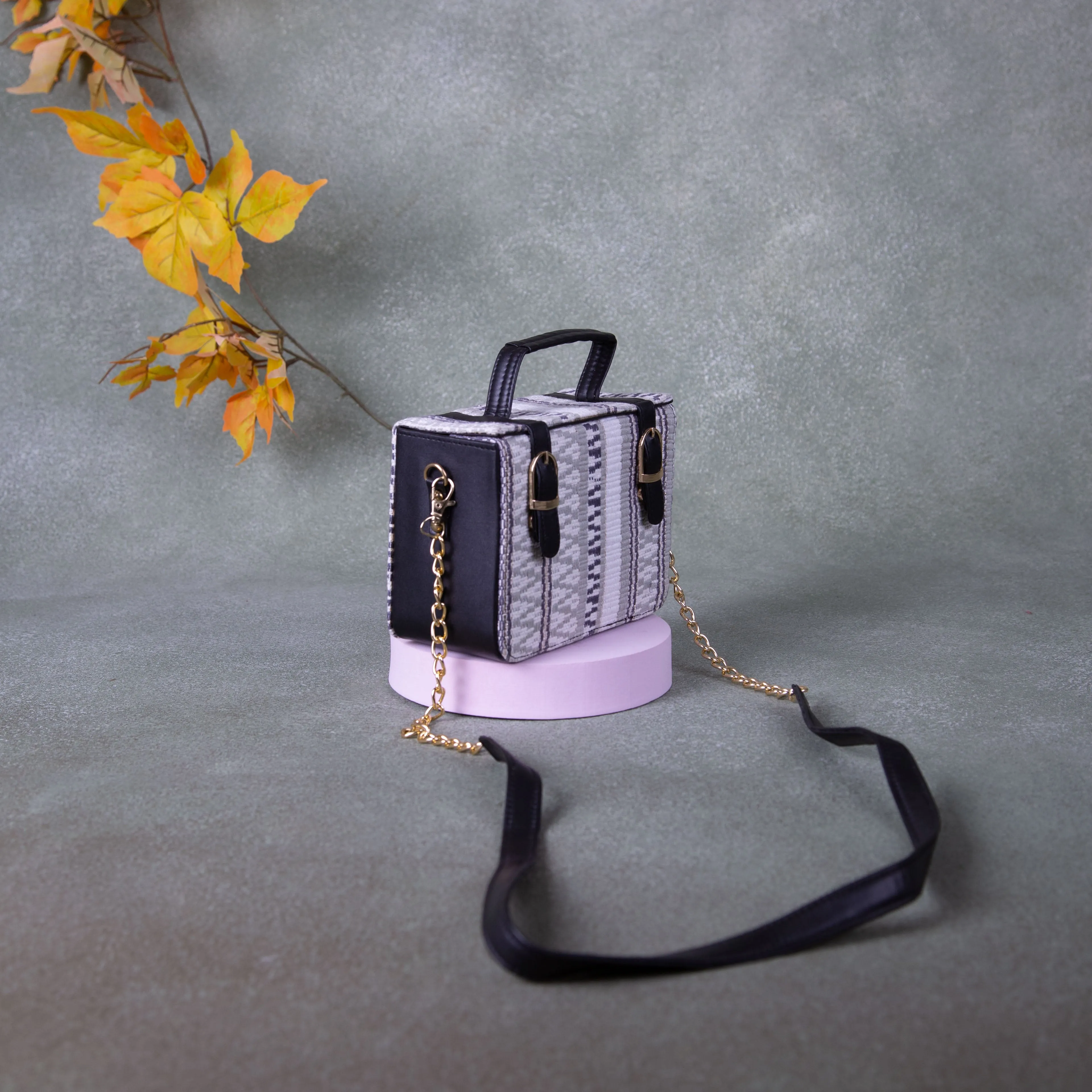 Cuboid Case Sling bags White with Black Colour Zig Zag Design.