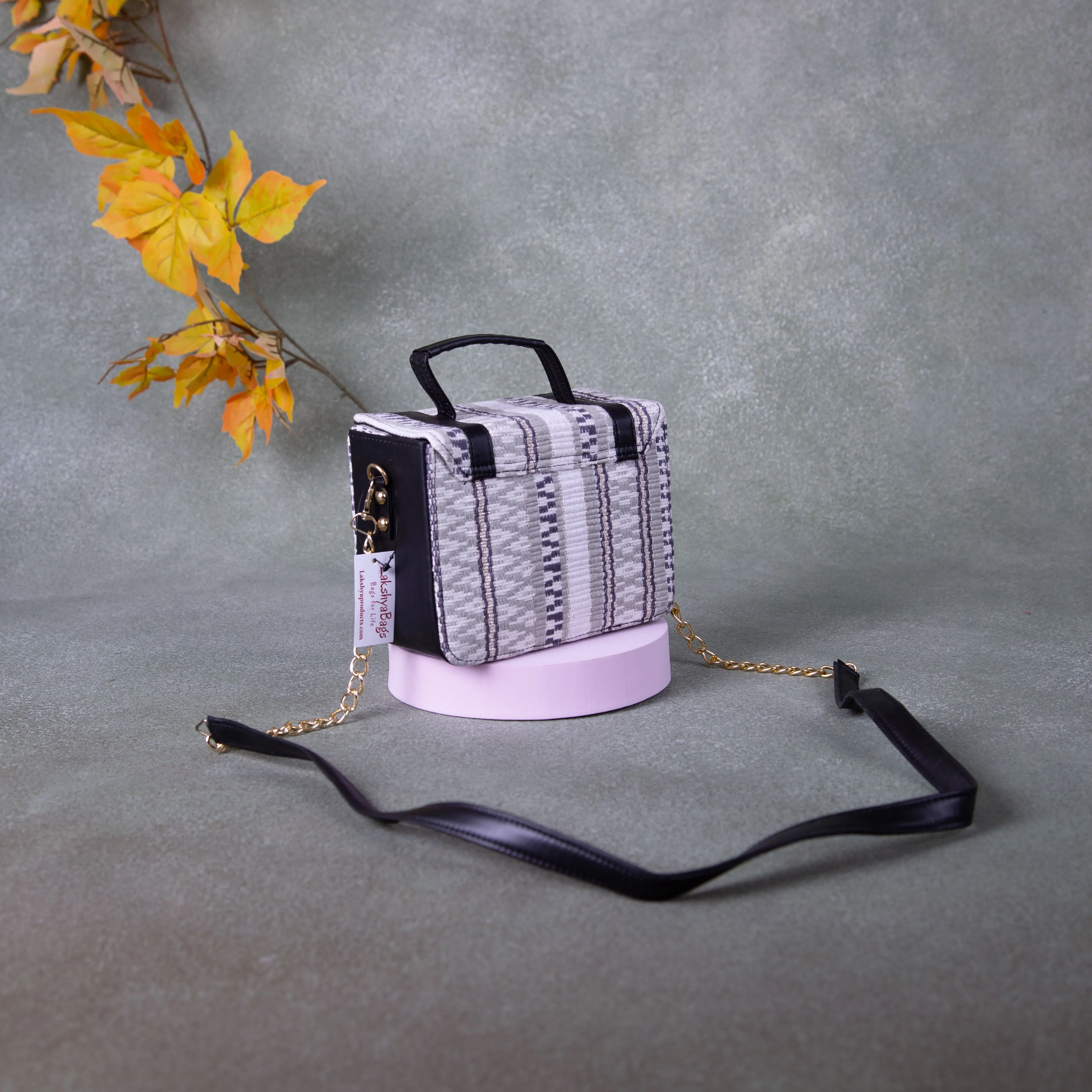 Cuboid Case Sling bags White with Black Colour Zig Zag Design.
